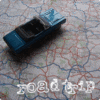 A blue and black vehicle icon with a light blue top sits on a patterned background with white, red, and blue lines, displaying '2004-01-17' text at the bottom.