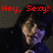 Pixelated image of a person with dark hair and purple clothing, red text 'Hey, Sexy!' above, dark background with pixelated texture.