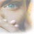 Pixelated close-up of a person's face showing eyes, nose, and mouth with visible pixelation artifacts.
