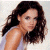 A pixelated image of a woman with long dark hair wearing a white sleeveless top, positioned next to green text reading 'Original Icons .com' on a solid background.