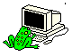 Green frog sits beside beige computer monitor displaying changing text and symbols