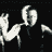 Animated sequence of a figure in dark clothing performing a repetitive motion against a black background with white and gray pixelated elements.