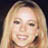 Static 48x48 pixel icon showing a close-up of a person with long blonde hair and light skin tone, rendered in low-resolution pixel art style with visible dithering and color blending.