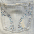 A contact sheet of four animated frames showing denim jeans pockets with text "Hollister is Love" in varying colors across the frames.