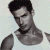 Pixelated grayscale image of a person in a white tank top with dark hair, next to green text reading 'Original Icons .com' on a solid background.