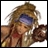 Pixelated image of a character with long brown hair wearing a blue headband and brown outfit, holding a large brown object.