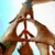 A split-screen image with a peace sign gesture on the left and text on the right, showing two states of text