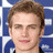 Pixelated image of a person with light brown hair against blue and white background, next to red text on black background.