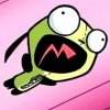 Green cartoon character with wide eyes and open mouth showing red 'M' shape on pink background.