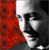 A pixelated image shows a partial profile of a person with dark hair and a red patterned background on the left side.