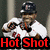 Pixelated image of a person in white sports uniform with dark cap, holding baseball bat, red text "Hot Shot" at bottom.