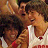 Animated contact sheet showing two frames of a pixelated image with text reading "Disney's High School Musical" on the right side and characters in sports jerseys on the left.
