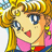 Pixelated anime-style character with blonde hair, blue eyes, and pink clothing, smiling with mouth open showing red lips and teeth.