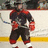 Pixelated hockey player in dark uniform with red accents holding a stick on ice rink, text below reads Bandits Hockey and Eat Sleep Hockey.