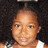 A pixelated image of a person with curly hair and a white top, accompanied by text expressing affection.