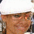 A 50x50 pixel animated buddy icon featuring a person in a white cap and shirt with Mickey Mouse ears, showing three sequential frames of motion.