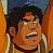 Pixelated close-up of a person with dark hair and a red mark on forehead, wearing a light-colored shirt against a warm-toned background.