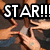 Pixelated image showing multiple hands reaching upward beneath bold text reading "STAR!!!!!" in white letters with black outlines.