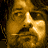 Animated icon features two golden-toned faces with red text elements on black background, displaying motion in facial details and text blur.