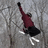 A skier in maroon and black attire glides on a gray textured background with white ski tracks, framed by red containing text