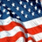 American flag on left, blue background with pixelated text promoting Meagan F. for Class Treasurer vote.