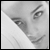 A black-and-white close-up of a woman's face with a white pillow, transitioning to a blue background with text and diagonal white lines.