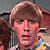 A 2x2 contact sheet of four animated frames showing a person in a colorful striped shirt with text overlays, each frame displaying the phrase "Look what I can do!" in different styles and positions.