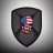 A shield-shaped icon with a dark gray border contains a pixelated face showing blue, pink, and brown tones against a light gray gradient background.