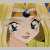 Pixelated close-up of a character with large eyes, light skin, and brown hair, set against a yellowish background with blurred shapes.