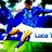 Pixelated image of a soccer player in blue jersey and white shorts on green field with blurred background, text 'italy' above and 'rocks' below.