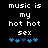 Pixelated text reads 'music is my hot hot sex' above blue heart symbols on a black background, with one heart changing color between frames.