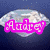 A diamond-shaped icon with a blue background displays the name 'Audrey' in pink pixelated text that appears and disappears across frames.