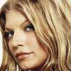 Static close-up portrait of a person with light brown wavy hair and blue eyes, cropped to show face and upper shoulders against a plain background.