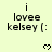 A light yellow background displays repeated text "i lovee kelsey (:" with pixelated heart symbols appearing and disappearing in a pattern