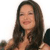 A static image of a person with long dark hair, light skin, and a neutral expression against a plain white background.