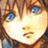 Pixelated close-up of a character's face with blue eyes, brown hair, and light skin tone in a static 48x48 icon format.
