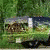 Animated sequence showing a green and blue vehicle with silver wheels in two distinct positions against a grassy background.