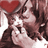 Pixelated image of a person with brown hair and a red heart symbol, overlaid with white text on a black background.