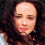 A four- shows a person with long dark hair in different poses and expressions, including closed eyes and a slight smile