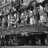 Pixelated grayscale image with indistinct shapes and varying shades of gray, no clear subjects or text visible.