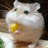 Pixelated hamster with yellow food in mouth, blue background split into two sections with text.