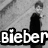 A four- of pixelated images with overlaid text: top-left shows a figure in dark clothing, top-right displays 'got' over a person's head, bottom-left features sunglasses and 'Bieber SWAG!' text