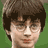 Static pixelated icon of a person with dark brown hair, glasses, and light skin against a green background.