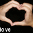 Two hands form a heart shape against a black background with partial text 'LOVE' visible in the lower-left corner.