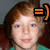 Pixelated close-up of a person with brown hair and light skin, wearing a green top, with an orange equal sign symbol on the right side.
