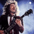 A pixelated figure with long blonde hair plays a guitar against a blue sky background, transitioning from holding the instrument to displaying text.