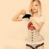 Pixelated image of a person in red and black lingerie against a light beige background.