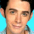 A 50x50 pixel buddy icon split into two frames showing a person's face on the left and green text on a dark background on the right, with visible pixelation and dithering effects.