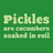 Green pixelated text on green background next to a fuzzy green creature with two large eyes on black background.