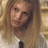 Static 48x48 pixel icon showing a close-up of a person with long light brown hair wearing a white shirt and dark tie against a blurred background.